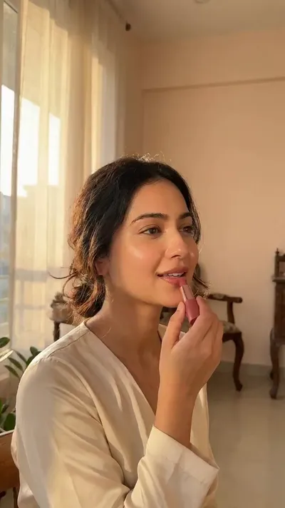 AI-generated vertical beauty Reel of a woman applying makeup in warm golden hour light